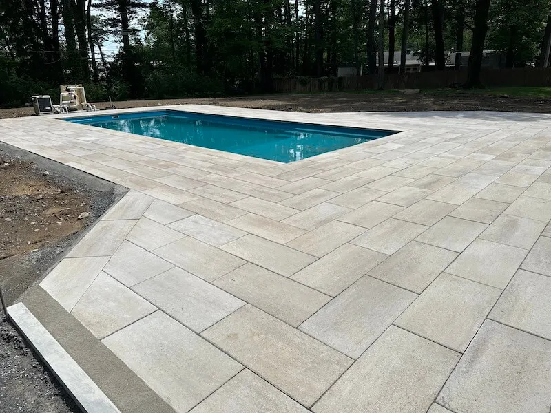 New Imagine Freedom 26 fiberglass pool with paver pool deck Guilderland NY — Capital Land Companies