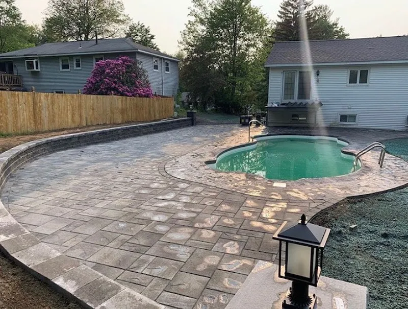 brick-pavers-installed-around-pool-deck